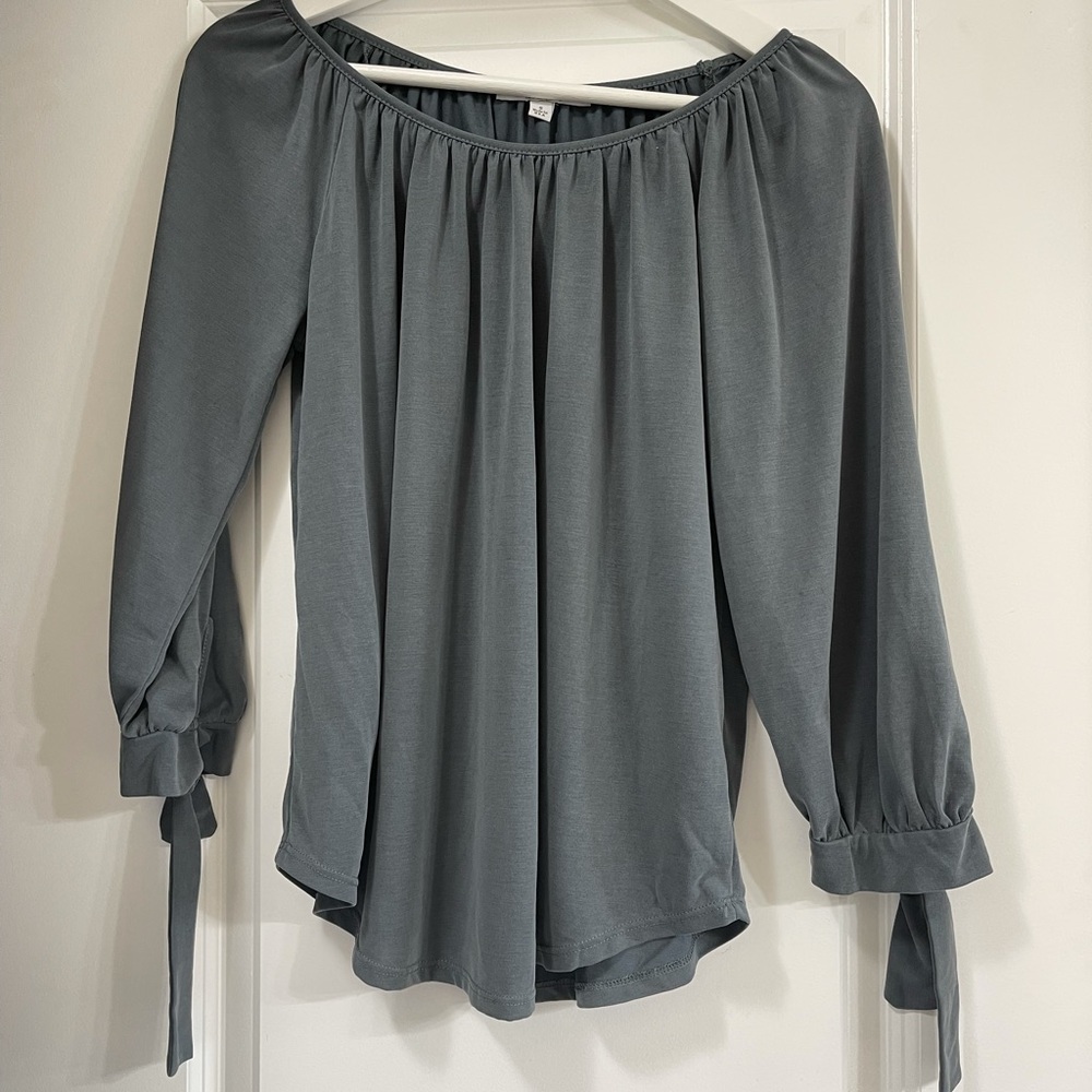 Blouse top with tie sleeves.